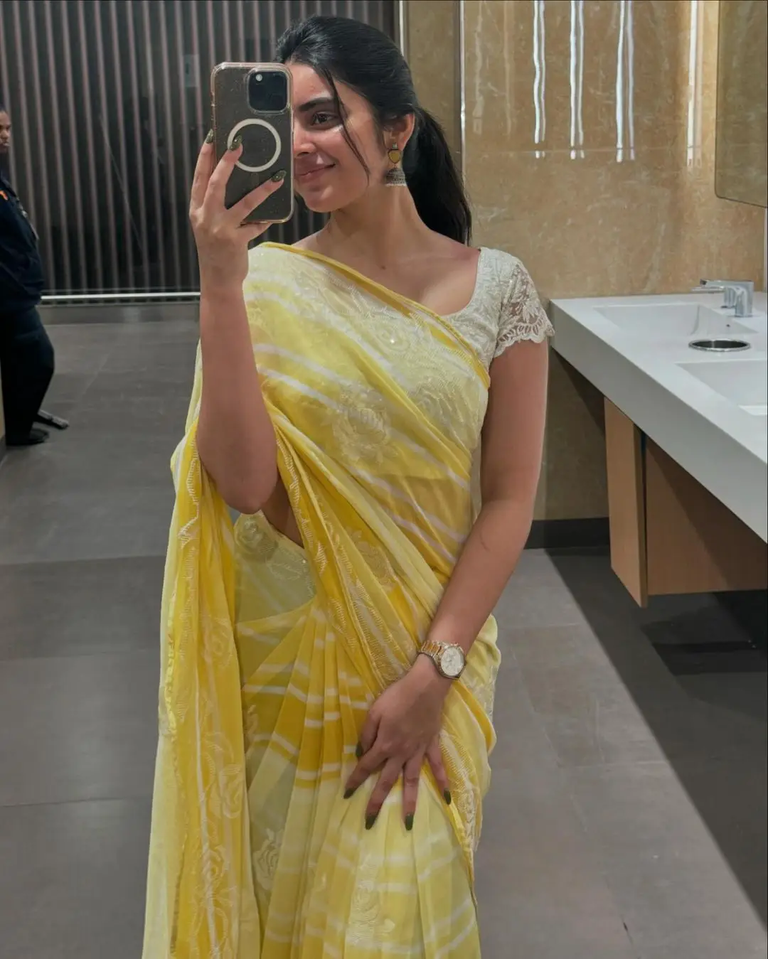 Kushita Kallapu In Traditional Yellow Saree White Blouse